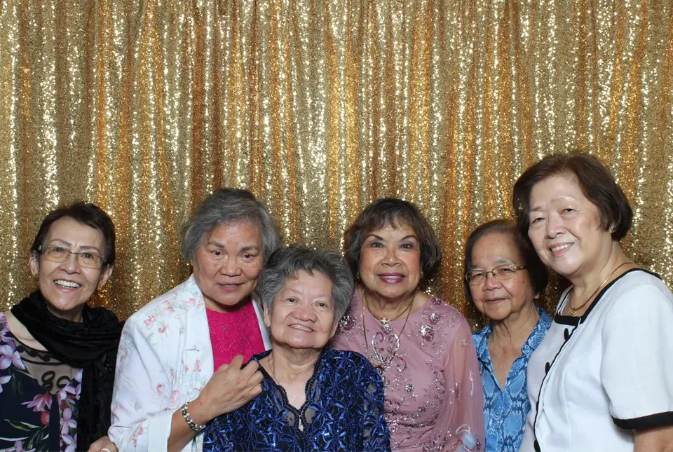 A group of women standing next to each other.