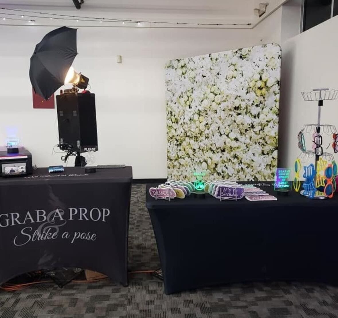 A photo booth set up in the middle of an office.